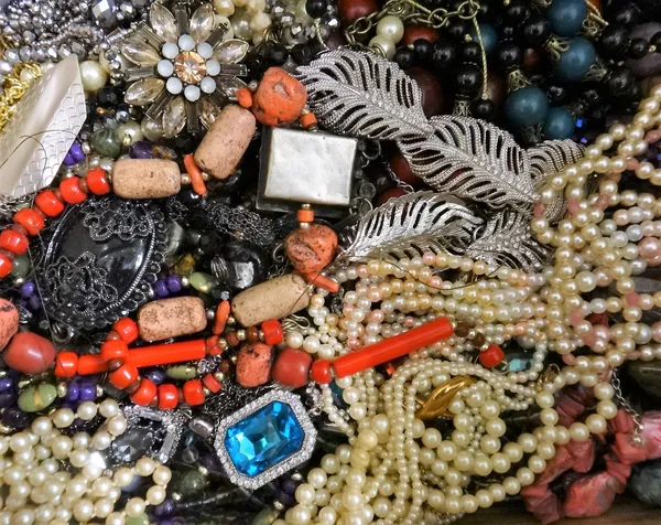 A large collection of costume jewellery, including bead and other necklaces, imitation pearls, bracelets, bangles, earrings, rings, two scent bottles