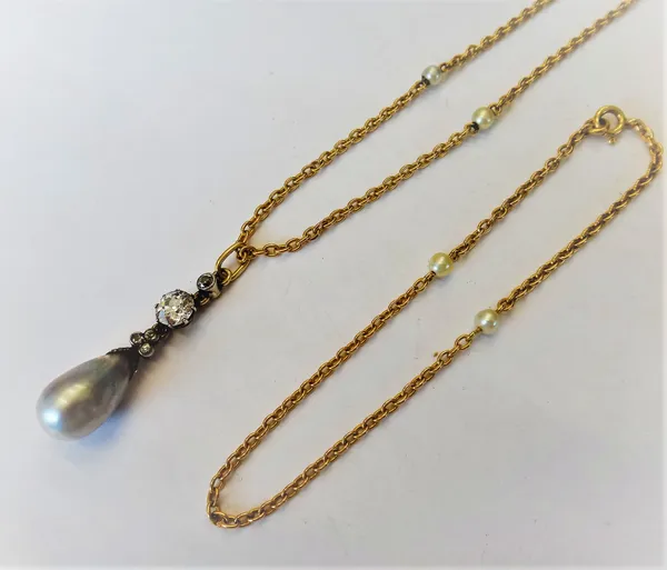 A gold backed and silver set diamond and cultured pearl pendant necklace, claw set with the principal cushion shaped diamond above three small cushion