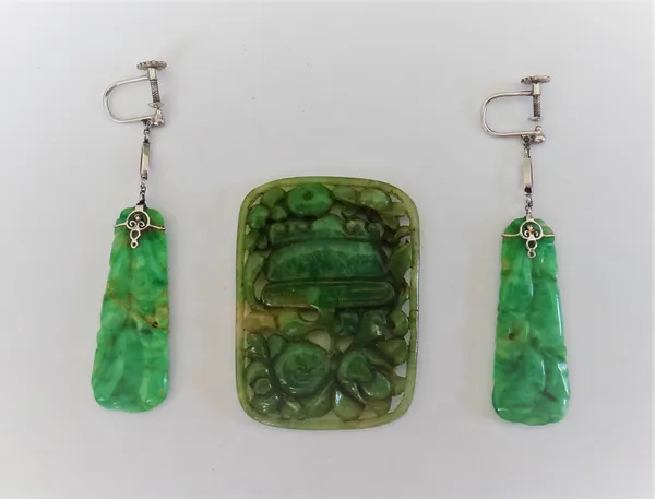 A pair of carved jade pendant earrings, decorated with fruit, the tops having screw fittings and a carved jade curved rectangular panel, designed as a