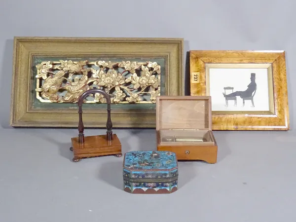 A small Chinese gilt carved panel depicting birds 43cm x 18cm, a cloisonné box, a rosewood watch stand, a marble music box and a silhouette picture, (