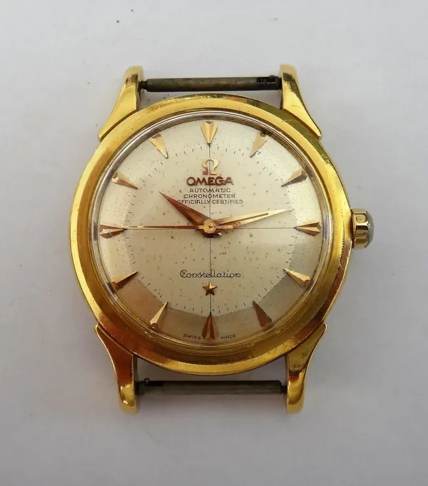 An Omega Constellation Automatic gold cased gentleman's wristwatch, the signed circular silvered dial with gilt arrow shaped numerals, tapering gilt h