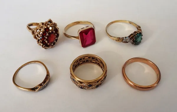 A gold ring, mounted with a cut cornered rectangular synthetic red gem, detailed 9 CT, a 9ct gold and garnet set cluster ring (one garnet lacking), a