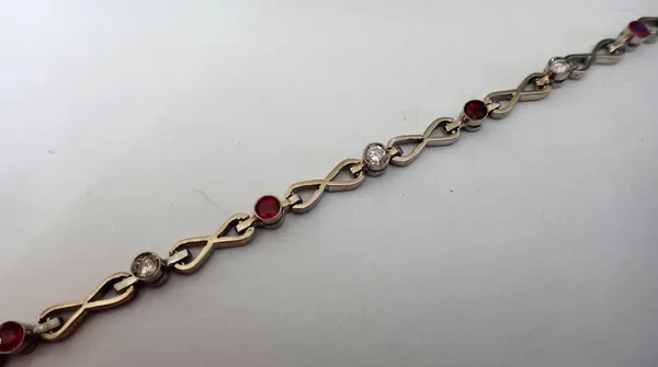 A ruby and diamond bracelet, collet set with a row of circular cut diamonds alternating with circular cut rubies and with figure of eight divisions at