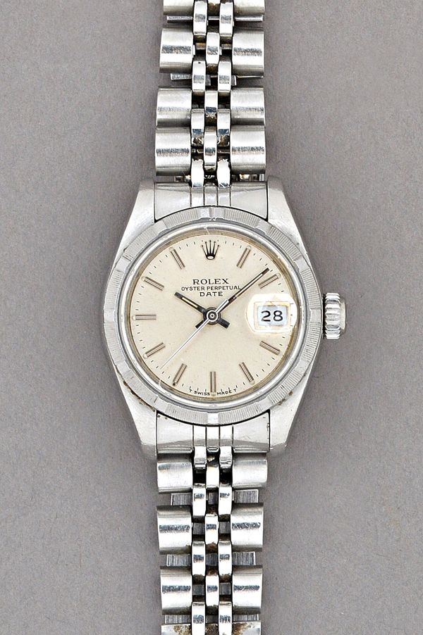 A Rolex Oyster Perpetual Date steel lady's bracelet wristwatch, the signed silvered dial with baton shaped numerals, centre seconds and with a date of