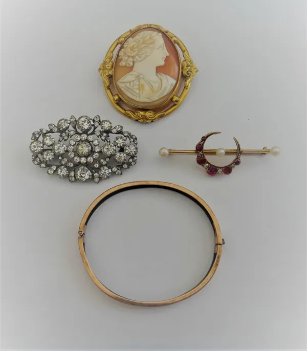 A gold, ruby, diamond and cultured pearl brooch, designed as a crescent on a bar, a Victorian 9ct gold oval hinged bangle, on a snap clasp, Chester 18