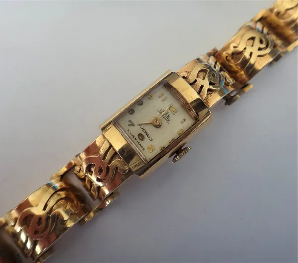 An Orano gold curved rectangular cased lady's bracelet wristwatch, the signed rectangular silvered dial with gilt Arabic numerals and with plain gilt