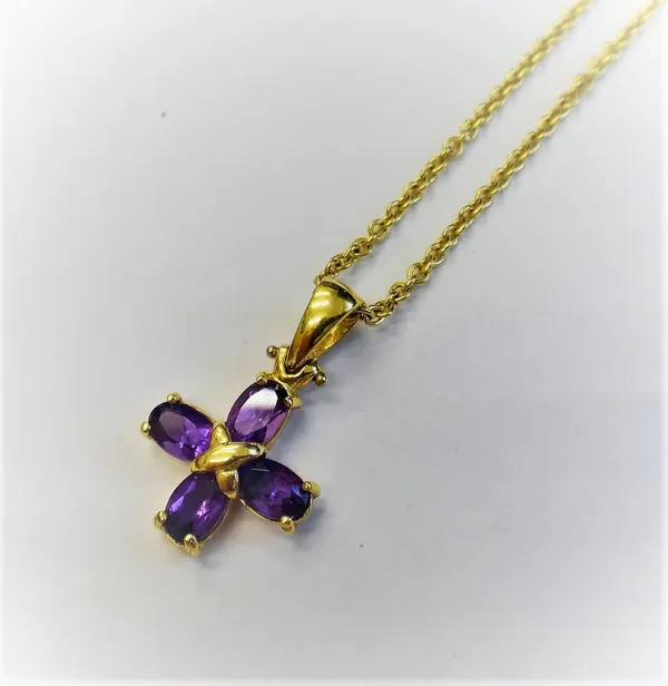 A gold and amethyst four stone pendant, mounted with oval cut amethysts, detailed 750 CRISO, with a gold oval link neckchain, on a boltring clasp, det