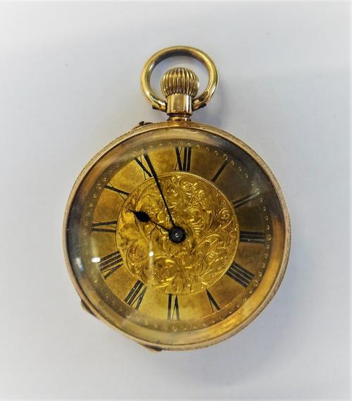 A gold cased, keyless wind, openfaced lady's fob watch, with a gilt jewelled movement, the base metal inner case presentation inscribed, the engraved