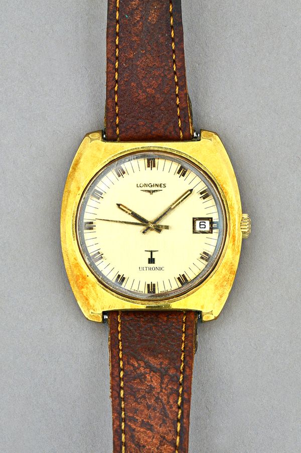 A Longines Ultronic gilt metal fronted and steel backed gentleman's wristwatch, the signed gilt dial with centre seconds and with a date of the month