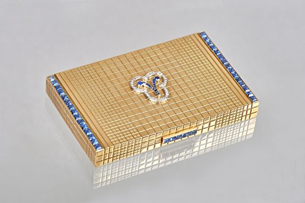 An Asprey London 9ct gold, diamond and synthetic sapphire set lady's rectangular powder compact, the interior of the lid fitted with a mirror, the ext