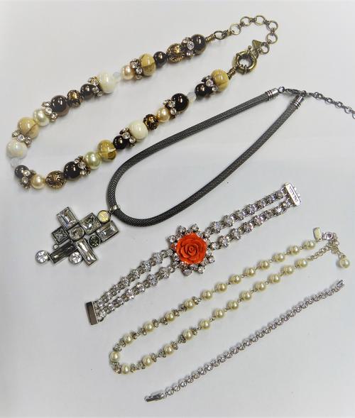 A Prada colourless gem bracelet with a salmon coloured ceramic rose motif to the centre, a Bulatti necklace spaced with beads and colourless gems, a B