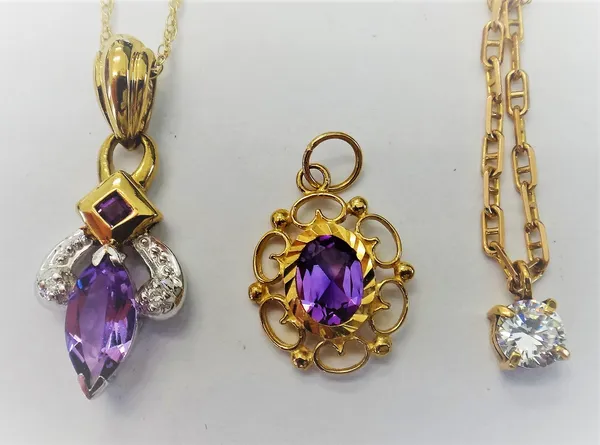 A 9ct two colour gold, amethyst and diamond set pendant, with a neckchain, a colourless gem set solitaire pendant, with a 9ct gold neckchain, on a bol