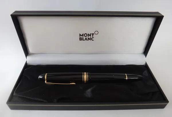 A Mont Blanc Meisterstuck gilt metal mounted black plastic ballpoint pen, with a Mont Blanc case.