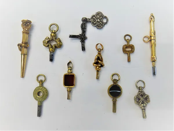 A rectangular cornelian set watch key, a European double ended watch key, possibly Dutch, a paste imitating banded agate set watch key and seven furth