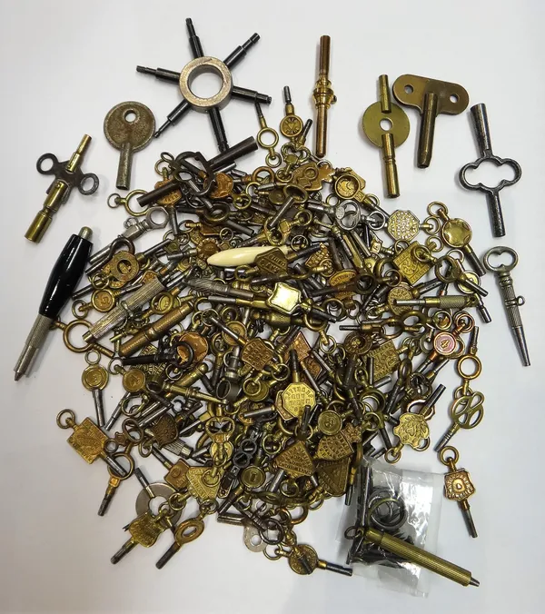 A large collection of mostly brass mounted watch keys, including some keys advertising watchmakers and jewellers and a few further keys, (qty).