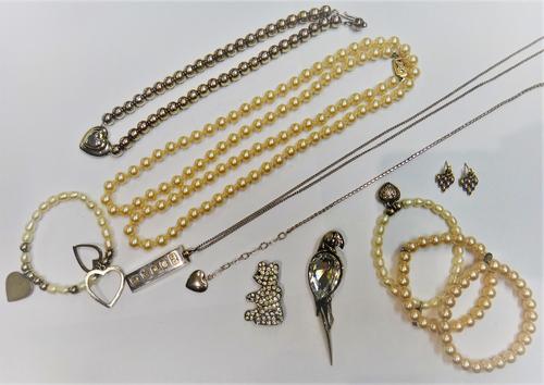 Two freshwater cultured pearl bracelets, two imitation pearl bracelets, a silver ingot shaped pendant, with a silver neckchain, a pair of 9ct two colo