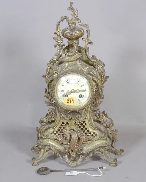 A French Louis XVI style metal mantel clock, with urn finial, enamel dial, eight-day two train movement with countwheel strike and hammer striking a b