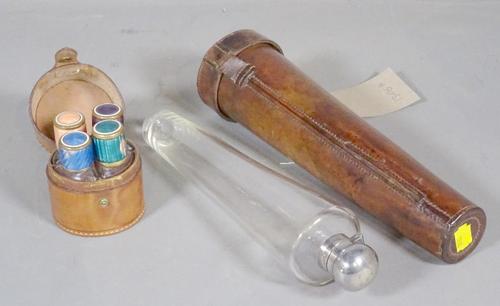 A 19th century leather cased hunting flask of tapering form, 27cm long and four scent bottles in a leather case, (2).   CAB