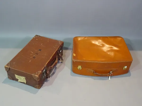 A 20th century brown leather case and another, (2).   ROST