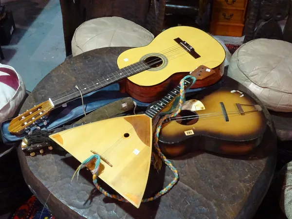 A 20th century six string guitar, another and a balalakai, (3).   BAY 1