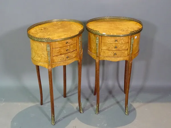 A pair of Louis XVI style walnut oval three drawer occasional tables with brass galleried tops, 40cm wide x 72cm high.   D4