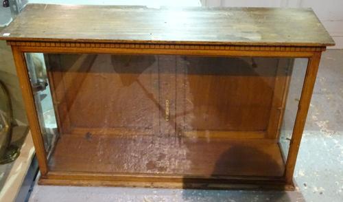 An early 20th century mahogany and glass display cabinet, 106cm wide x 66cm high.   BAY 3