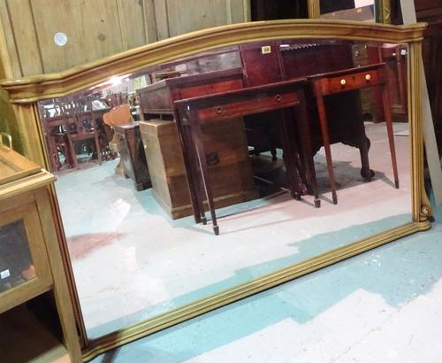 A 20th century mahogany overmantel arch top rectangular wall mirror, 162cm wide x 92cm high.   M10