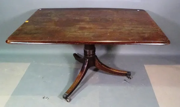 An early 19th century mahogany rectangular tilt top table on splayed supports, 122cm long x 68cm high.   K3