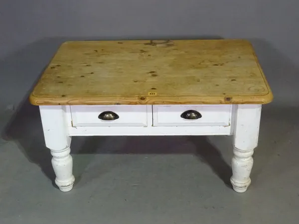 A rectangular white painted pine coffee table with two drawers, 89cm wide x 61cm high.   K8