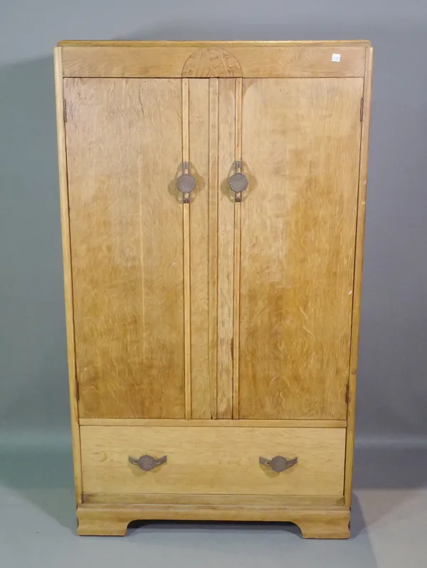 An early 20th century oak two door wardrobe, 77cm wide x 134cm high.  A6