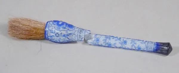 A Chinese blue overlay glass brush handle, six character Qianlong mark in a line, probably 19th century, the head carved with two dragon panels, the h