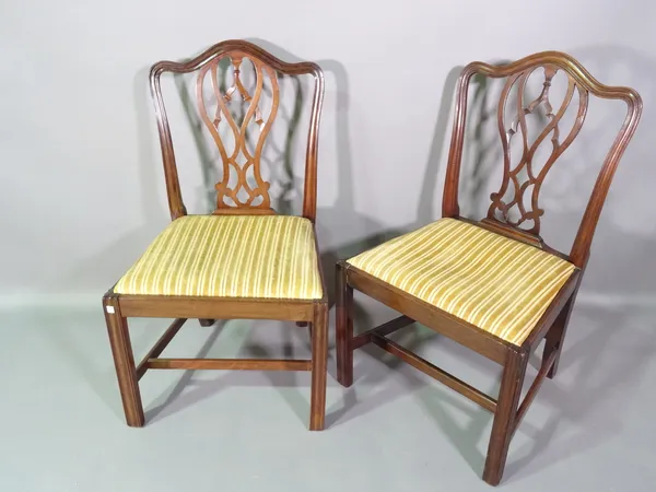 A pair of George III style mahogany dining chairs with splat backs on square supports, (2).  C7