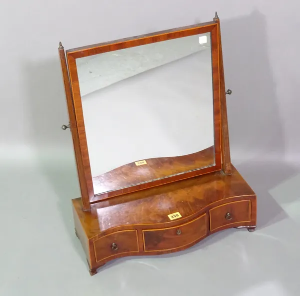 A George III mahogany serpentine dressing mirror with three drawers on bracket feet, 47cm wide x 58cm high.   C8