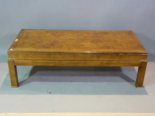 A 20th century elm campaign style rectangular coffee table on block supports, 130cm wide x 39cm high.   H3