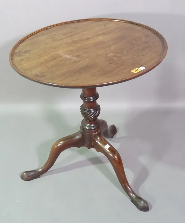 A George III mahogany tilt top tripod table with dished top, 60cm wide x 67cm high.   D7