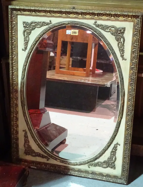 A late 19th century cream painted parcel gilt wall mirror with bevelled oval plate, 61cm high x 81cm wide.   A8