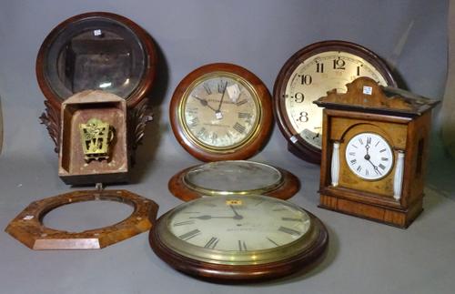 A large quantity of mostly 19th century and later dial and wall clocks, some lacking movements, (qty).   ROST