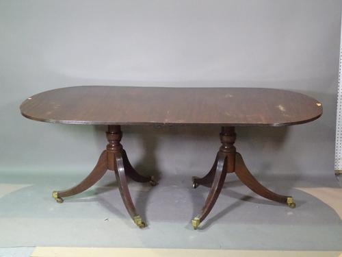 A George III style mahogany D-end dining table with one extra leaf, 186cm long x 74cm high x 249cm fully extended.   H6