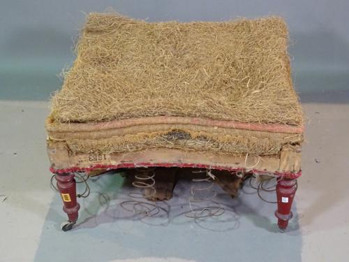 A Victorian rectangular footstool on red lacquered tapering supports, 66cm wide x 38cm high.  BAY 2