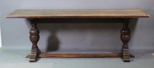 An 18th century style oak refectory table on turned columns united by stretcher, 214cm wide x 76cm high.   G6