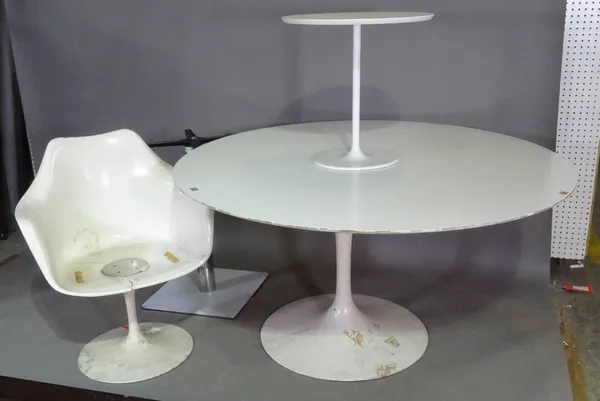 A 20th century white laminate circular table 132cm wide and a similar smaller, a white resin chair and a metal table base, (4). L5