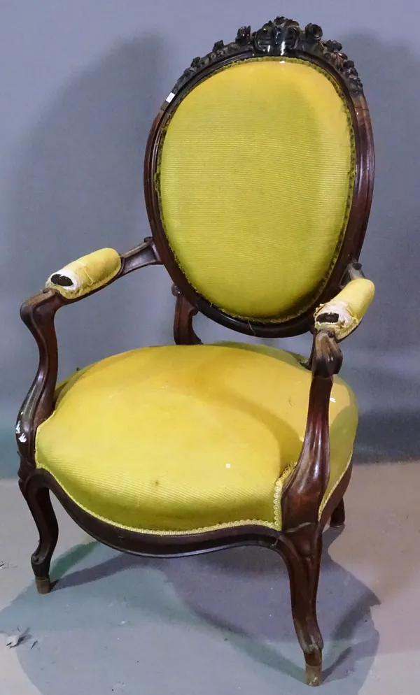 A Victorian walnut framed open armchair.   D6