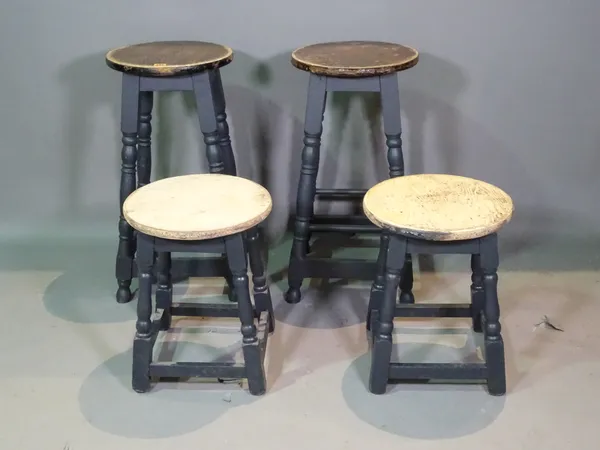 A pair of 20th century black painted bar stools and another smaller pair, (4).   D9