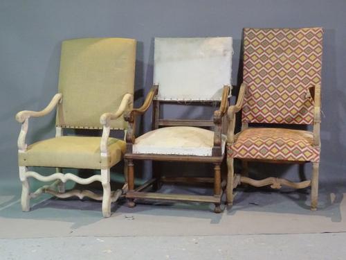 A group of 19th century Continental walnut highback open armchairs, (3).   E7