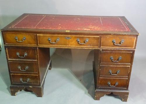 A 20th century mahogany pedestal desk with red leather top, 120cm wide x 75cm high.  H4