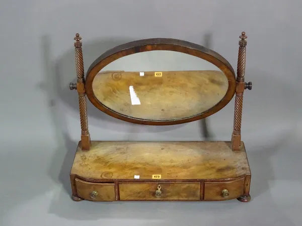 A 19th century Regency style mahogany oval three drawer toilet mirror, 67cm wide x 59cm high.   BAY 1