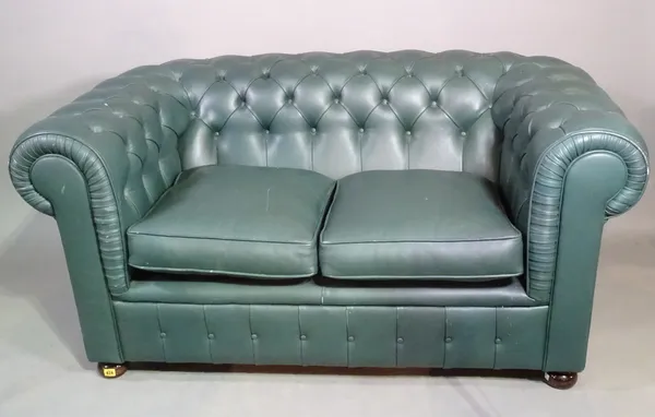 A 20th century Chesterfield sofa with green leather button back upholstery on bun feet, 160cm wide.  H4