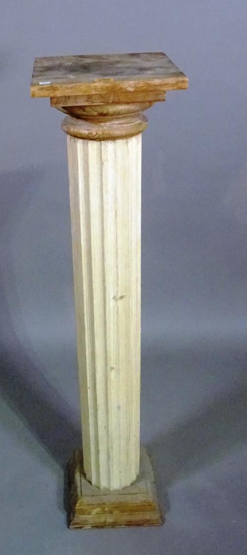 A 20th century stained pine jardiniere stand on fluted column and plinth base, 26cm wide x 104cm high.   BAY 2