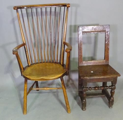An early 20th century spindle back open armchair with H-frame stretcher and an 18th century oak side chair, (2).   J5