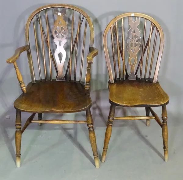 A matched set of four 19th century ash and elm wheel back scullery chairs, (4).   G9